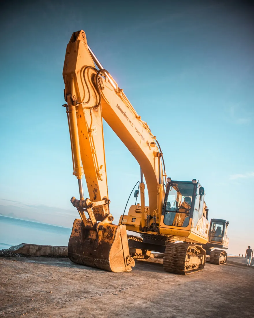 Excavator parked on exposed earth